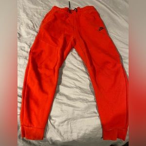 Red Nike tech fleece pants